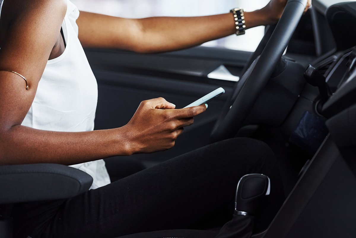A woman texting and driving